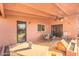 Covered patio with patio set is ideal for relaxing and enjoying the outdoor view at 945 W 10Th St, Mesa, AZ 85201