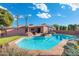 Stunning backyard oasis with sparkling pool and outdoor living space is perfect for entertaining at 945 W 10Th St, Mesa, AZ 85201