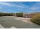 Wide backyard featuring gravel landscaping, block fence providing privacy and defining the outdoor space at 10018 N 103Rd Ave, Sun City, AZ 85351