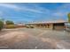 Exterior view of the backyard, showcasing a covered patio that creates an inviting outdoor living space at 10018 N 103Rd Ave, Sun City, AZ 85351