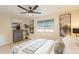 This comfortable bedroom has a ceiling fan and natural light at 10018 N 103Rd Ave, Sun City, AZ 85351