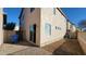 Backyard with block wall, brick pavers, and new air conditioning unit at 10039 W Kingman St, Tolleson, AZ 85353