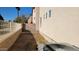 View of the backyard with block wall and a new air conditioning unit at 10039 W Kingman St, Tolleson, AZ 85353