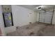 Spacious garage with an adjacent hot water heater at 10039 W Kingman St, Tolleson, AZ 85353