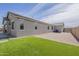 Lovely outdoor area featuring green turf, gravel landscaping, and a covered patio at 1232 E Silver Reef Dr, Casa Grande, AZ 85122