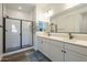 A modern bathroom featuring a glass shower and double sink vanity at 1232 E Silver Reef Dr, Casa Grande, AZ 85122