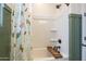 Bright bathroom featuring a shower-over-tub combination and a decorative curtain at 1232 E Silver Reef Dr, Casa Grande, AZ 85122