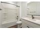 Clean bathroom with a shower and tub combination, white cabinets, and modern fixtures at 1232 E Silver Reef Dr, Casa Grande, AZ 85122