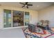 Relaxing covered patio with comfortable seating, stylish rug, and an inviting indoor-outdoor flow at 1232 E Silver Reef Dr, Casa Grande, AZ 85122