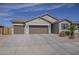 Inviting one-story home boasting a spacious three-car garage, neutral stucco, drought-tolerant landscaping, and a clay tile roof at 1232 E Silver Reef Dr, Casa Grande, AZ 85122