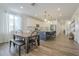 Bright, airy kitchen with an island and stainless appliances connecting to a dining area at 1232 E Silver Reef Dr, Casa Grande, AZ 85122