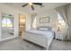 A spacious main bedroom with connected bathroom and ceiling fan at 1232 E Silver Reef Dr, Casa Grande, AZ 85122