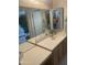 Bathroom vanity with ample counter space and storage cabinets, creating a functional design at 13034 W Peach Blossom Dr, Sun City West, AZ 85375