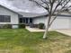 Lovely single-story house with a well-manicured lawn and a welcoming front porch at 13034 W Peach Blossom Dr, Sun City West, AZ 85375