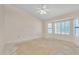 Spacious bedroom boasting a ceiling fan, lots of natural light and bay windows with shutters at 13764 W Meeker Blvd, Sun City West, AZ 85375