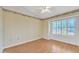 Light-filled bedroom with vaulted ceilings, laminate floors, shuttered windows and decorative wallpaper at 13764 W Meeker Blvd, Sun City West, AZ 85375