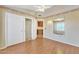 Bright bedroom with laminate floors, closet and decorative border at 13764 W Meeker Blvd, Sun City West, AZ 85375