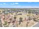 Community park with a grassy area, palm trees, and walking paths at 13764 W Meeker Blvd, Sun City West, AZ 85375