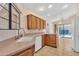 Bright kitchen with tile flooring, modern appliances, and wood cabinetry, offering ample storage and natural light at 13764 W Meeker Blvd, Sun City West, AZ 85375