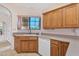 Kitchen featuring an undermount sink, wood cabinets, modern appliances, and a view out of the window at 13764 W Meeker Blvd, Sun City West, AZ 85375