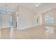 Open-concept living room with tile floors, neutral paint, and ample natural light at 13764 W Meeker Blvd, Sun City West, AZ 85375