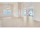 Spacious living room featuring tile flooring, shutters, and high ceilings, creating an inviting atmosphere at 13764 W Meeker Blvd, Sun City West, AZ 85375