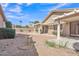 Back patio area with ample seating space, shaded pergola, and drought-resistant landscaping at 13764 W Meeker Blvd, Sun City West, AZ 85375