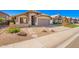 Charming single-story home with a xeriscaped front yard and neutral earth tone color palette at 1421 E Gary Dr, Chandler, AZ 85225