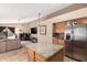 Modern kitchen open to the living area, featuring granite countertops and stainless steel appliances at 1421 E Gary Dr, Chandler, AZ 85225