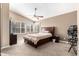 Spacious main bedroom featuring a ceiling fan, a window with shutters, and carpet flooring at 1421 E Gary Dr, Chandler, AZ 85225