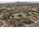 Overhead view of a luxurious home with a tile roof, surrounded by desert foliage at 15135 E Monument Rd, Scottsdale, AZ 85262