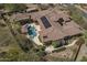 Expansive home featuring a backyard pool, spa, and solar panels on a red tile roof at 15135 E Monument Rd, Scottsdale, AZ 85262