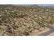 Scenic aerial view of a desert community dotted with homes and native vegetation at 15135 E Monument Rd, Scottsdale, AZ 85262