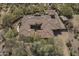 Elevated view of a sprawling estate, highlighting the lush desert landscape at 15135 E Monument Rd, Scottsdale, AZ 85262