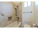 Bathroom featuring tile shower, built in niche, and bronze fixtures at 15135 E Monument Rd, Scottsdale, AZ 85262