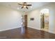 Primary suite featuring wood floors and doorway leading to bath with soaking tub at 15135 E Monument Rd, Scottsdale, AZ 85262