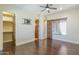 Bedroom view showcasing hardwood floors, closet space, and a window with natural light at 15135 E Monument Rd, Scottsdale, AZ 85262