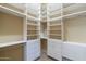 Spacious walk-in closet with custom built-ins, shelving, and drawer space at 15135 E Monument Rd, Scottsdale, AZ 85262