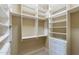 Walk-in closet with custom shelving and drawers providing ample storage space at 15135 E Monument Rd, Scottsdale, AZ 85262