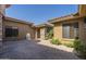 Desert home featuring a private, brick-paved front courtyard with beautiful exterior fountain at 15135 E Monument Rd, Scottsdale, AZ 85262