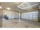 A well-organized garage space with ample storage and modern lighting, equipped with utility features at 15135 E Monument Rd, Scottsdale, AZ 85262