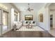 Professionally staged living room with hardwood floors, light-colored walls, and seating at 15135 E Monument Rd, Scottsdale, AZ 85262