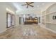 Open floor plan featuring travertine floors and French doors leading to the kitchen at 15135 E Monument Rd, Scottsdale, AZ 85262