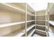 Large walk-in pantry with ample shelving for storage and organization at 15135 E Monument Rd, Scottsdale, AZ 85262