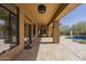 Covered patio with recessed lighting provides shade and access to the backyard and pool at 15135 E Monument Rd, Scottsdale, AZ 85262