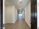 Inviting entryway with light walls, wood-look floors, and recessed lighting at 15781 W Cheryl Dr, Waddell, AZ 85355