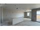 An interior view showcasing a spacious room with drywall and a bar-style element, offering a glimpse of potential design at 15781 W Cheryl Dr, Waddell, AZ 85355