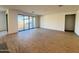 Bright living area with tile floors and sliding glass doors at 15781 W Cheryl Dr, Waddell, AZ 85355