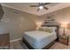 Inviting bedroom featuring ceiling fan, carpet, natural light and equipped with side table and decorative pillows at 1749 E Medlock Dr, Phoenix, AZ 85016