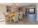 Dining room with wood floors and ample seating is adjacent to the living room and kitchen at 1749 E Medlock Dr, Phoenix, AZ 85016